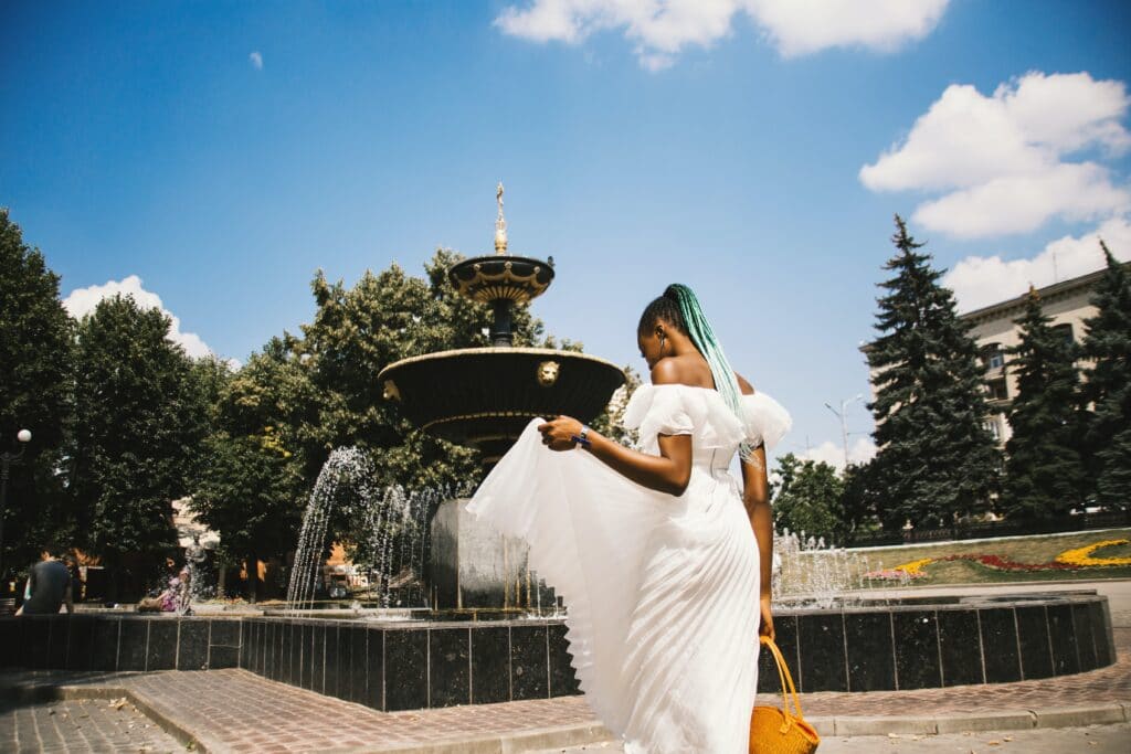 woman standing near water fountain