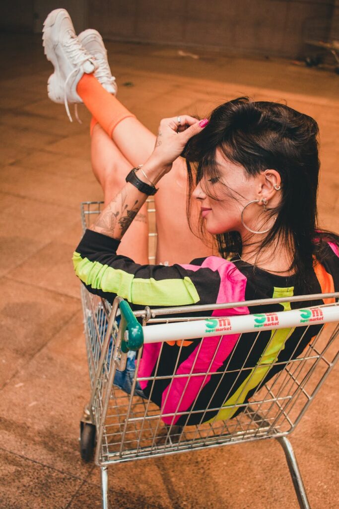 woman sitting in a shopping cart